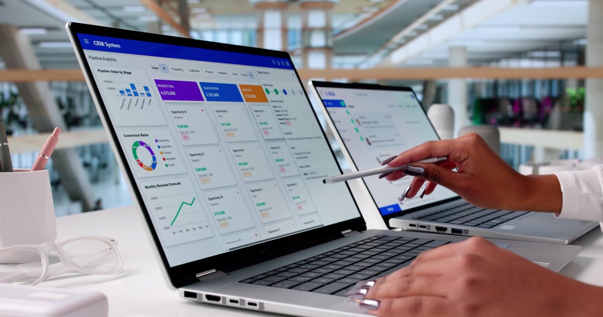 A business owner reviewing customer information on a computer